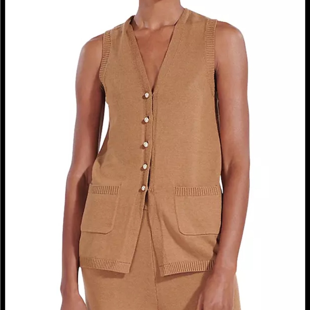 An easy layering piece, this wool-blend vest is finished with pearlescent